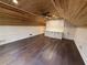 Open bonus room with hardwood floors, wood ceiling, and built-in cabinets at 215 Buck Run, Loganville, GA 30052