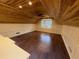 Spacious bonus room with hardwood floors, wood ceiling, and a window with a view at 215 Buck Run, Loganville, GA 30052