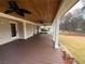 Expansive covered patio featuring ceiling fans, wood ceiling, and outdoor living space at 215 Buck Run, Loganville, GA 30052