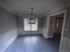 Elegant dining room with modern lighting, wainscoting, and updated flooring at 215 Buck Run, Loganville, GA 30052
