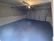 Clean garage featuring painted floor, neutral walls, and an automatic door at 215 Buck Run, Loganville, GA 30052