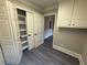 Hallway area showing extra storage with built in shelves and access to other rooms at 215 Buck Run, Loganville, GA 30052