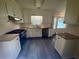Bright kitchen with granite countertops, white cabinetry, and stainless steel appliances at 215 Buck Run, Loganville, GA 30052