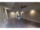 Spacious living room boasting hardwood floors, fresh paint, and abundant natural light at 215 Buck Run, Loganville, GA 30052