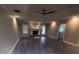 Inviting living room featuring a fireplace, hardwood floors, and ample natural light at 215 Buck Run, Loganville, GA 30052