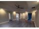 Open-concept living room featuring hardwood floors, recessed lighting, and neutral paint at 215 Buck Run, Loganville, GA 30052