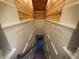 Stairwell with wood railing, hardwood stairs, and white paneled walls at 215 Buck Run, Loganville, GA 30052