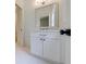 Bright bathroom boasts a white vanity with marble countertop and modern fixtures at 2717 Skyland Dr, Brookhaven, GA 30319