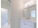 Bathroom featuring neutral walls, large mirror, and sink basin at 2717 Skyland Dr, Brookhaven, GA 30319