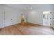 Bedroom showcasing hardwood flooring, neutral walls, and an open doorway to a bathroom at 2717 Skyland Dr, Brookhaven, GA 30319