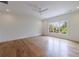 Spacious bedroom with large windows providing ample natural light and beautiful hardwood floors at 2717 Skyland Dr, Brookhaven, GA 30319