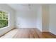 An empty bedroom with hardwood floors, ample natural light, and white walls at 2717 Skyland Dr, Brookhaven, GA 30319