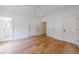 Bedroom with three doors, hardwood floors, a ceiling fan, and a bathroom entry at 2717 Skyland Dr, Brookhaven, GA 30319