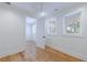 Bedroom featuring hardwood floors, a ceiling fan, and natural light from the windows at 2717 Skyland Dr, Brookhaven, GA 30319