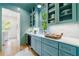 Stylish butler's pantry with elegant blue cabinets, marble counters, and built-in wine fridge at 2717 Skyland Dr, Brookhaven, GA 30319