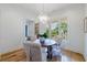Bright dining room with chandelier and views of a veranda creates a welcoming atmosphere for gatherings at 2717 Skyland Dr, Brookhaven, GA 30319