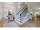 Elegant entryway with hardwood floors, staircase, and view into the dining room at 2717 Skyland Dr, Brookhaven, GA 30319