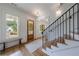 Bright entryway with hardwood floors, staircase, and view of the front door at 2717 Skyland Dr, Brookhaven, GA 30319