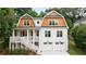 Exterior of a two-story white home with a shingled roof and a two-car garage at 2717 Skyland Dr, Brookhaven, GA 30319