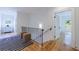 Hallway with hardwood floors, a black and white striped rug, and a view of a bedroom at 2717 Skyland Dr, Brookhaven, GA 30319