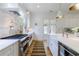 Bright kitchen features stainless steel appliances, a farmhouse sink, and white cabinets at 2717 Skyland Dr, Brookhaven, GA 30319