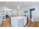 Bright kitchen with island, farmhouse sink, stainless steel appliances, and views to the living room at 2717 Skyland Dr, Brookhaven, GA 30319