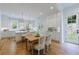 Spacious kitchen with white cabinets, island seating, marble countertops, and stainless-steel appliances at 2717 Skyland Dr, Brookhaven, GA 30319
