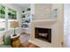 Living Room view features fireplace, hardwood flooring, and custom built-ins at 2717 Skyland Dr, Brookhaven, GA 30319