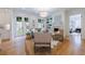 Bright living room with a fireplace, light wood floors, and french doors to the backyard at 2717 Skyland Dr, Brookhaven, GA 30319