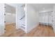 Hallway with bright hardwood floors leads to an entrance with a mudroom, bench seating, and cubbies at 2717 Skyland Dr, Brookhaven, GA 30319