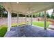 Covered patio with bluestone floor, wood ceiling, ceiling fan, and backyard view at 2717 Skyland Dr, Brookhaven, GA 30319