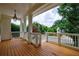 Spacious porch with wood flooring and white railings, perfect for enjoying outdoor living at 2717 Skyland Dr, Brookhaven, GA 30319