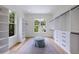 Spacious walk-in closet with custom shelving, storage drawers, and natural light at 2717 Skyland Dr, Brookhaven, GA 30319
