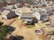 Aerial view of the house with backyard, fire pit, and surrounding neighborhood at 6145 Stargazer Way, Cumming, GA 30028