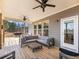 Cozy back porch featuring outdoor seating, ceiling fans, and a scenic view at 6145 Stargazer Way, Cumming, GA 30028