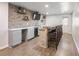 Finished basement bar area complete with brick facade and wood countertops at 6145 Stargazer Way, Cumming, GA 30028