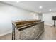 Finished basement bar area with a brick facade and wood countertop at 6145 Stargazer Way, Cumming, GA 30028