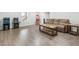 Finished basement provides a fun entertainment space with wood floors and arcade games at 6145 Stargazer Way, Cumming, GA 30028