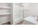 Bathroom featuring modern shower, vanity and built-in open shelving at 6145 Stargazer Way, Cumming, GA 30028