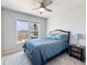 Cozy bedroom with a queen-sized bed, plush carpet, and a window view of the deck at 6145 Stargazer Way, Cumming, GA 30028