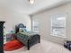 Bright bedroom featuring two windows, carpeted floor, and a bed with decorative pillows at 6145 Stargazer Way, Cumming, GA 30028