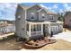 Two-story home with a well-manicured lawn and attached garage at 6145 Stargazer Way, Cumming, GA 30028