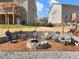 Stone fire pit with Adirondack chairs, perfect for outdoor gathering and relaxation at 6145 Stargazer Way, Cumming, GA 30028