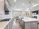 Gourmet kitchen with granite counters, stainless appliances, and gas cooktop at 6145 Stargazer Way, Cumming, GA 30028