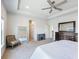 Spacious main bedroom boasts tray ceilings, a ceiling fan, and a view of the entryway at 6145 Stargazer Way, Cumming, GA 30028