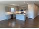 Modern kitchen with an island, stainless steel appliances, and gray cabinets at 670 Pineberry Dr, Grayson, GA 30017