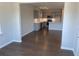 View of the modern kitchen and living area with an open layout and hardwood floors at 670 Pineberry Dr, Grayson, GA 30017