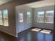 Sun-drenched sun room featuring hardwood floors, multiple windows, and access to the backyard at 670 Pineberry Dr, Grayson, GA 30017