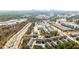 A nice aerial view of the community, showcasing the layout of the townhomes, lush greenery, and downtown skyline at 1047 Brandsford Nw St, Atlanta, GA 30318