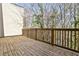Spacious outdoor balcony with wooden railing, perfect for enjoying nature at 1047 Brandsford Nw St, Atlanta, GA 30318